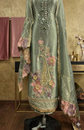 Pastel green embroidered ethnic suit with floral motifs and mirror work, displayed on mannequin