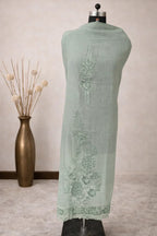 Pastel green ethnic dupatta with floral embroidery, displayed on mannequin, luxury wear