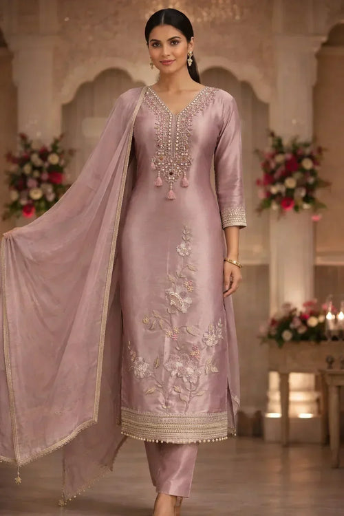 Elegant mauve salwar kameez with floral embroidery, tassel accents and matching dupatta