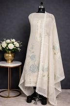 Ivory ethnic suit with pastel floral embroidery and lace details, displayed on mannequin