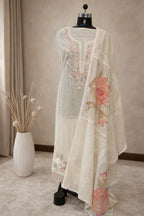 Ivory ethnic suit with floral and bird embroidery, sheer dupatta, displayed on mannequin