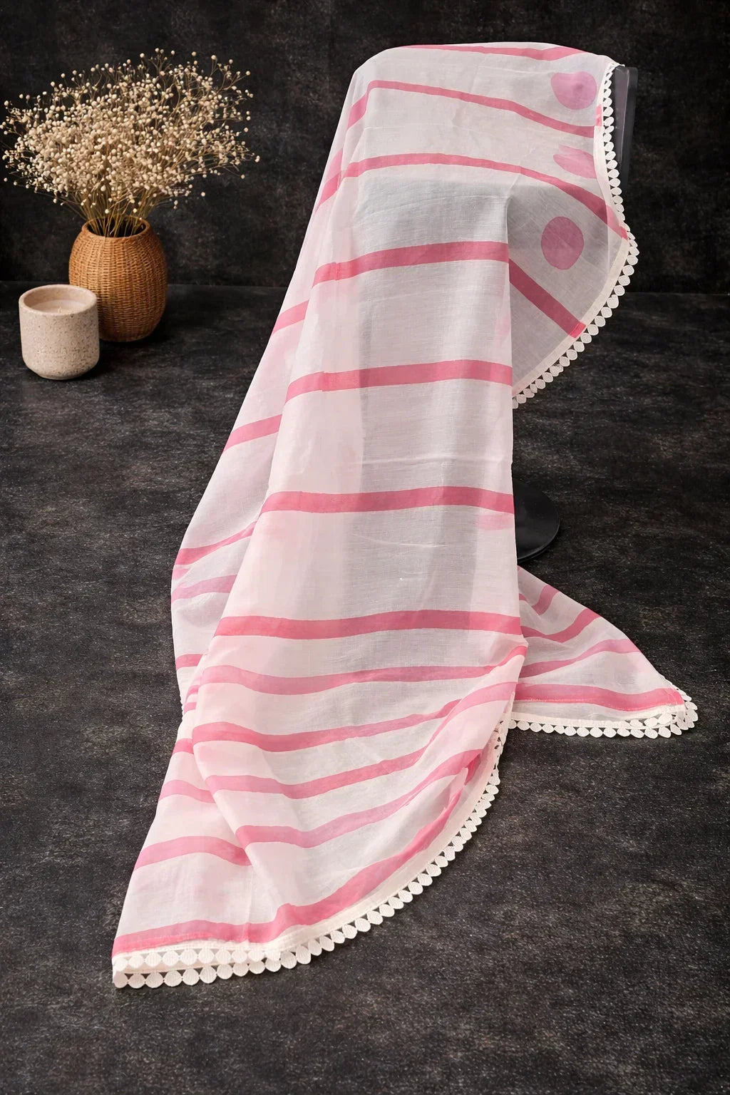 Sheer white dupatta with pink stripes and dots, scalloped lace border, displayed on dark background