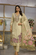 Woman wearing cream and gold Anarkali suit with floral and swan embroidery, festive ethnic wear
