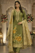 Woman wearing olive green embroidered Anarkali suit with floral dupatta, festive ethnic wear