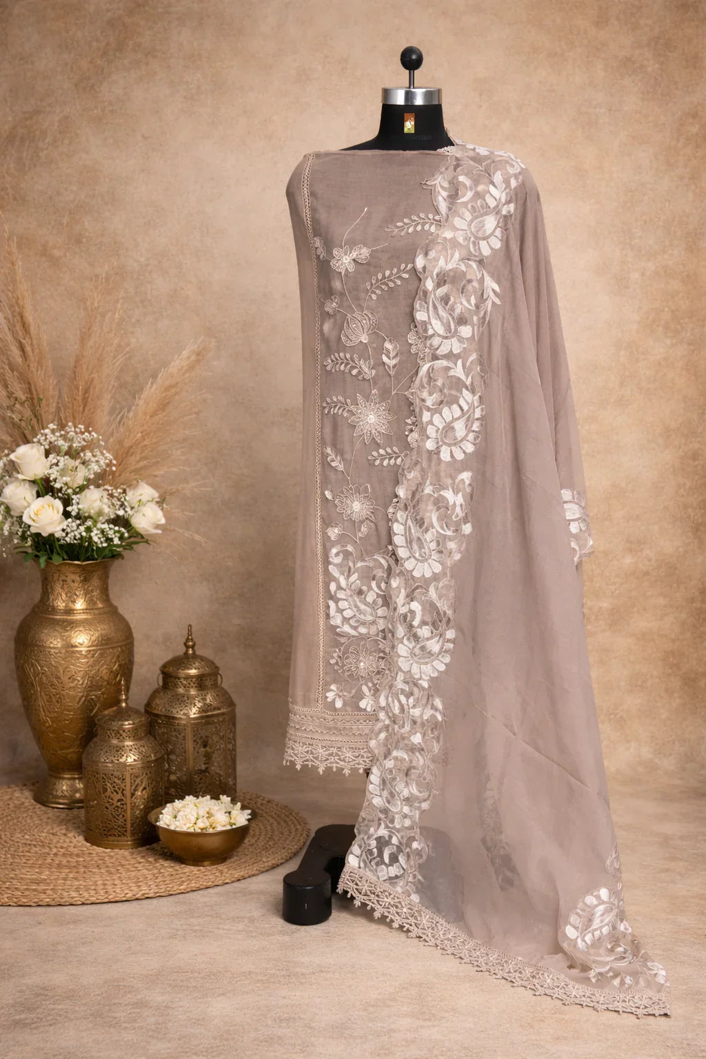 Beige embroidered organza dupatta with floral motifs displayed on a mannequin, luxury ethnic wear