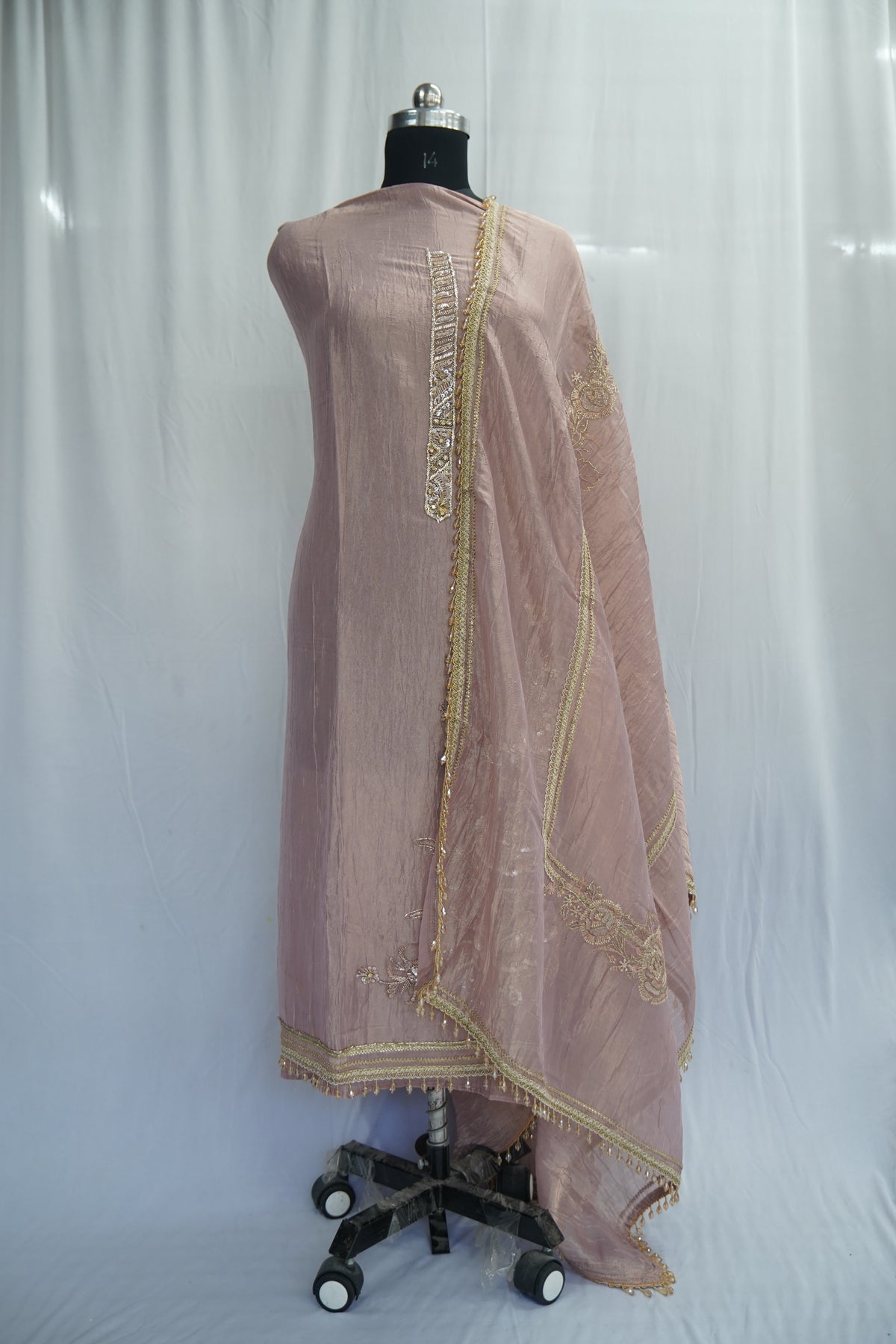 Bronze tissue top and dupatta, bottom Upada silk, handwork with multi thread and laces