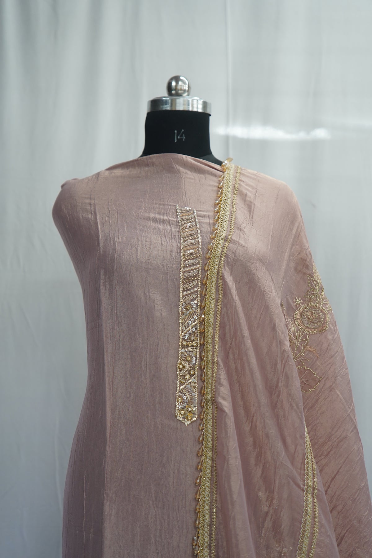 Bronze tissue top and dupatta, bottom Upada silk, handwork with multi thread and laces