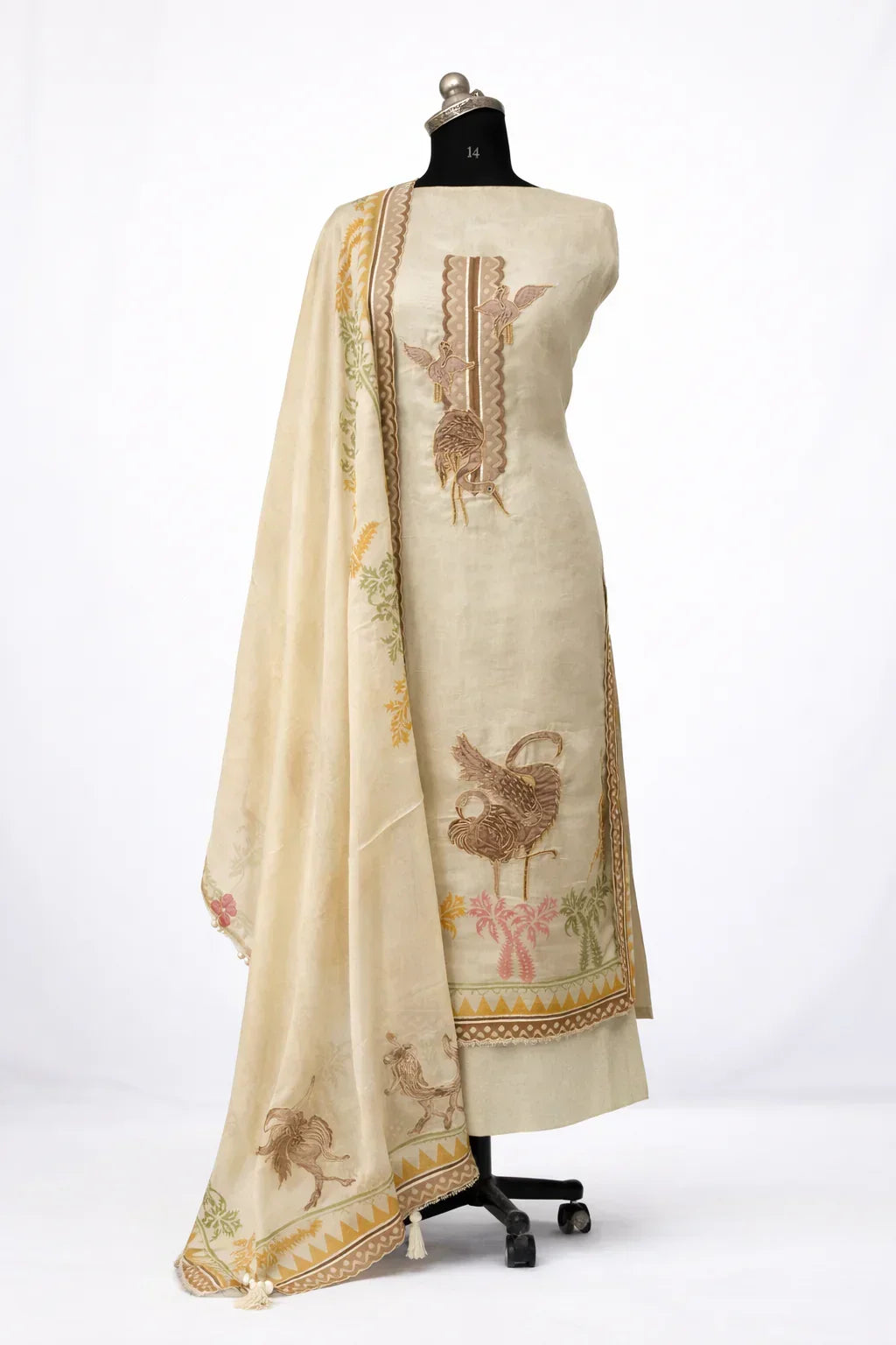 Ivory ethnic suit set with brown bird embroidery and floral dupatta on mannequin