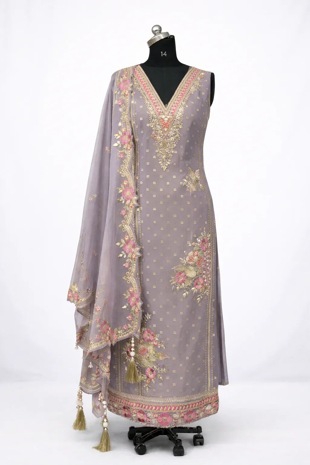 Lavender Anarkali suit with gold embroidery, floral motifs, and matching dupatta on mannequin