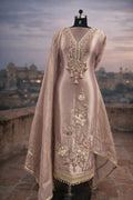 Embroidered mauve Anarkali suit with floral and mirror work, displayed on a mannequin outdoors