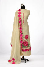 Beige ethnic suit with pink floral embroidery and matching dupatta on mannequin