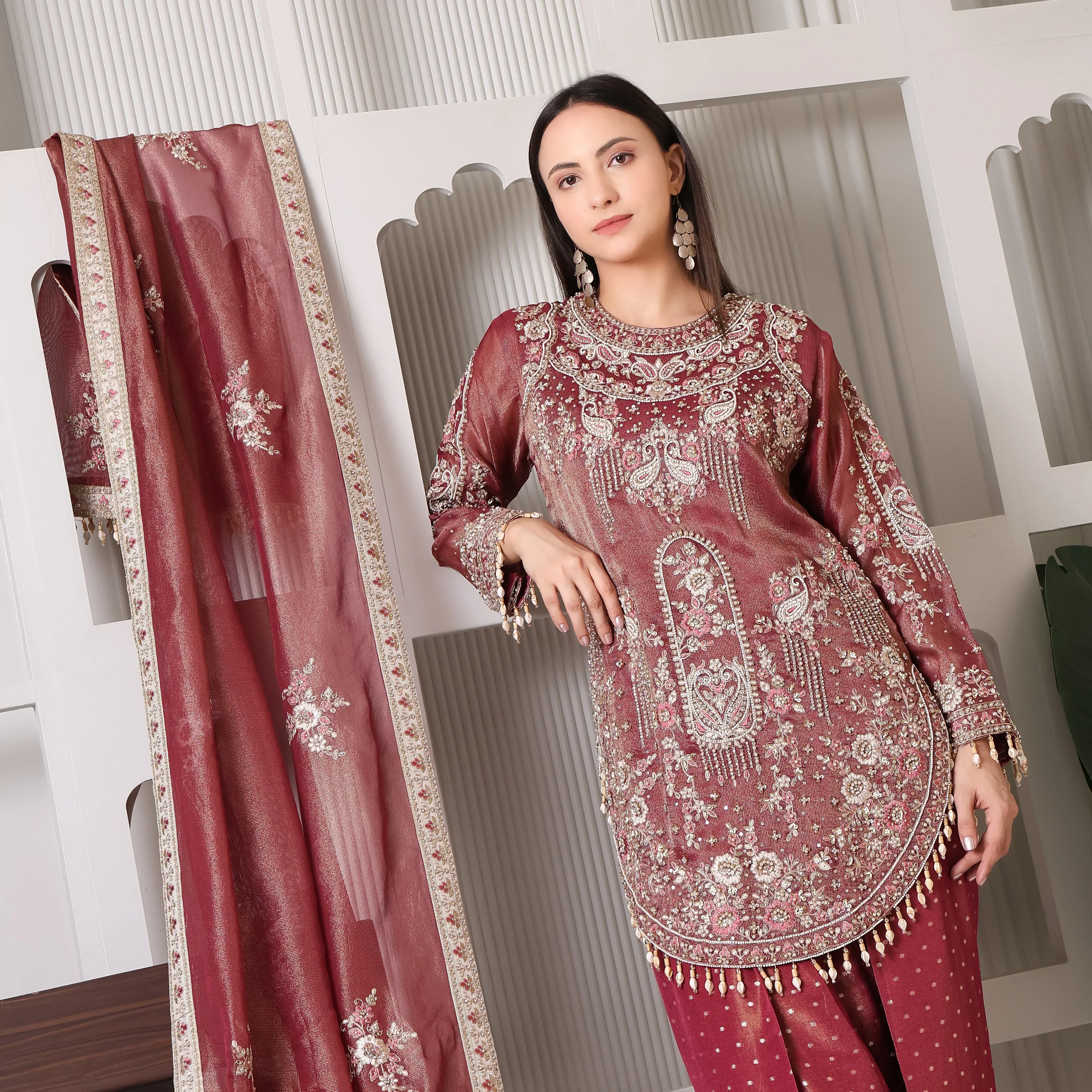 Woman in maroon embroidered ethnic suit with dupatta, festive Indian outfit