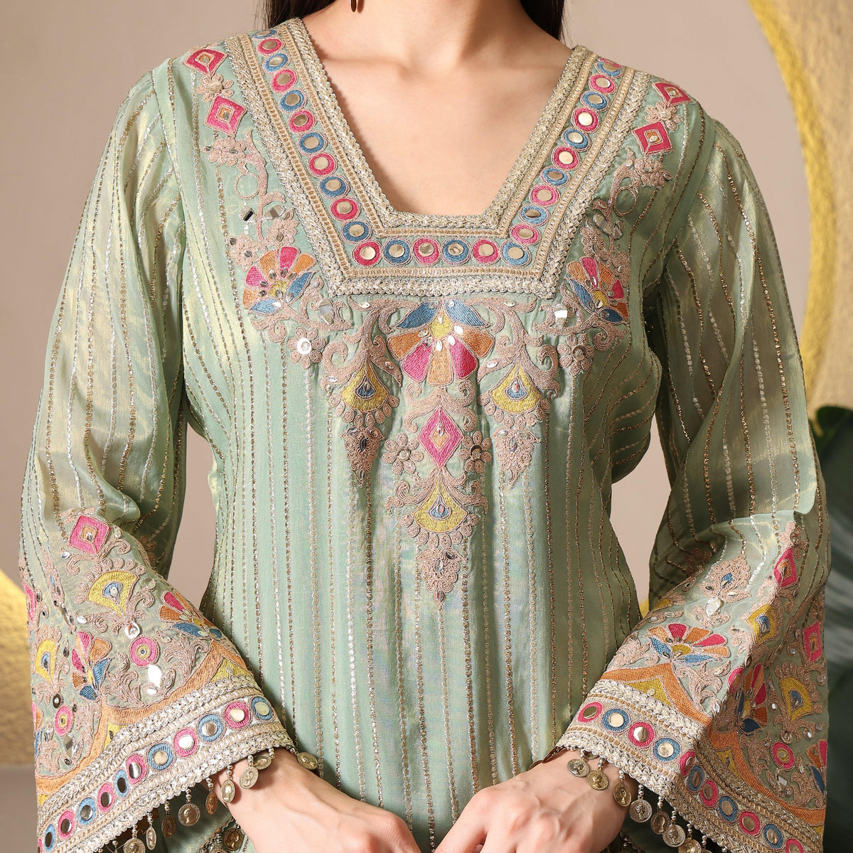 Pastel green ethnic kurta with floral embroidery, mirror work and flared sleeves