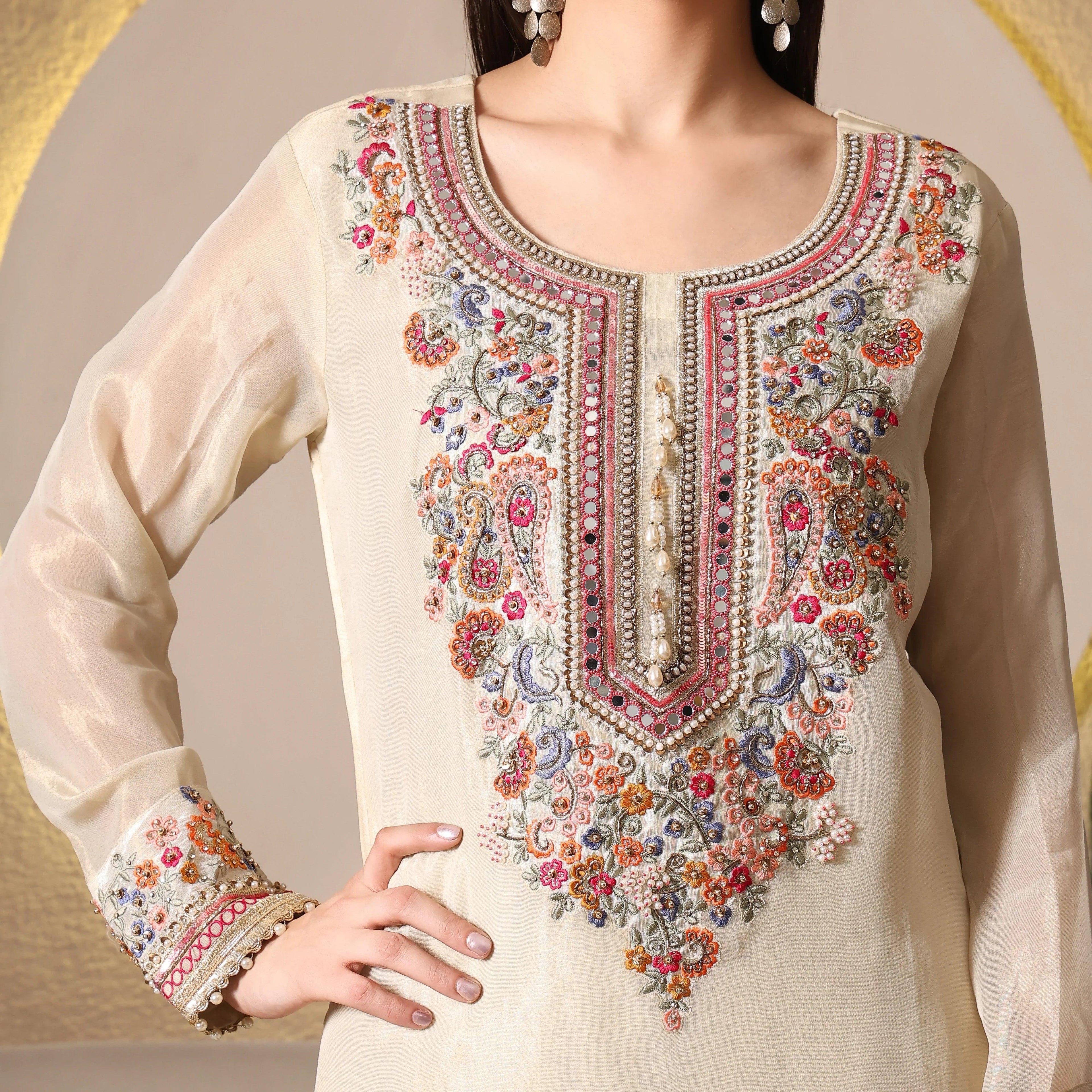 Ivory ethnic suit with intricate multicolor floral embroidery and beadwork, long sleeves