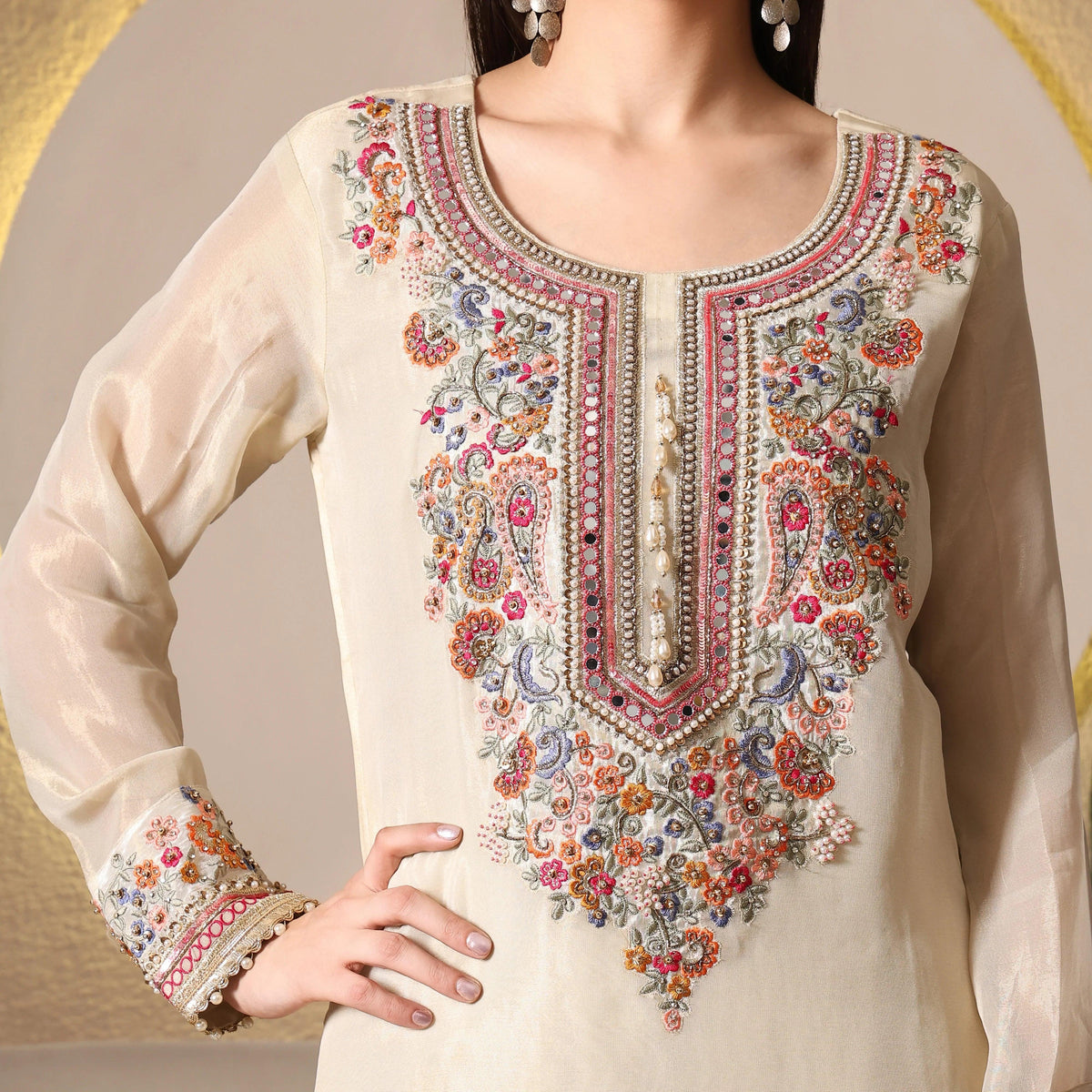 Ivory ethnic suit with intricate multicolor floral embroidery and beadwork, long sleeves