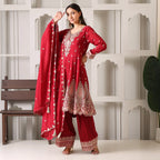 Woman wearing maroon embroidered Banarasi Anarkali suit with dupatta and palazzo pants