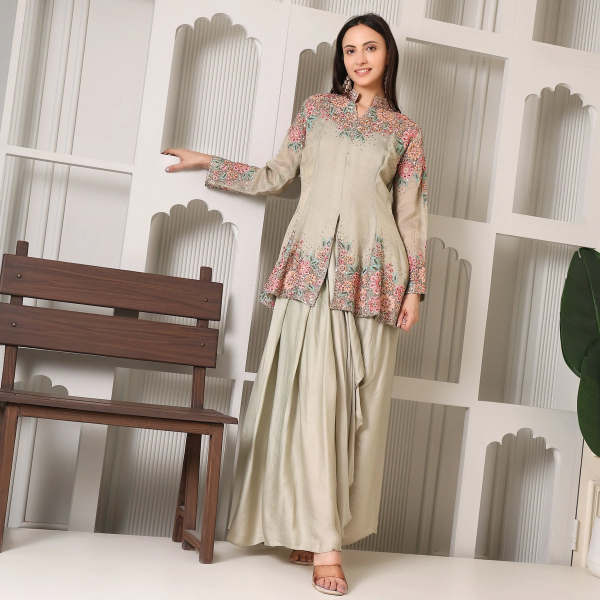Woman in luxury ethnic kurta set with floral embroidery, stylish festive outfit indoors