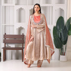 Woman in beige Banarasi Anarkali suit with coral dupatta, festive ethnic fashion
