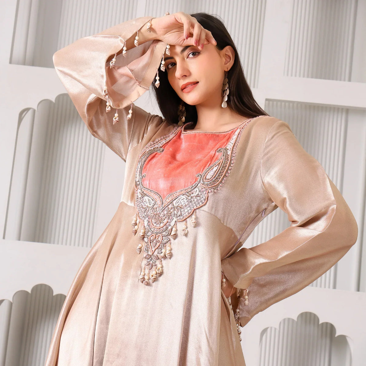 Woman in peach and gold Banarasi Anarkali suit with intricate embroidery, festive ethnic wear