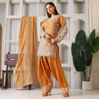Woman wearing mustard yellow embroidered ethnic suit with palazzo pants and matching dupatta