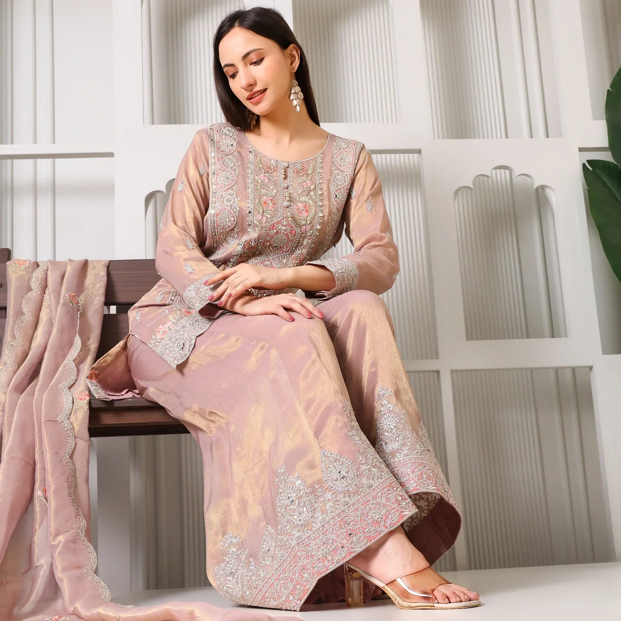 Woman in mauve embroidered Anarkali suit with matching dupatta, festive ethnic wear
