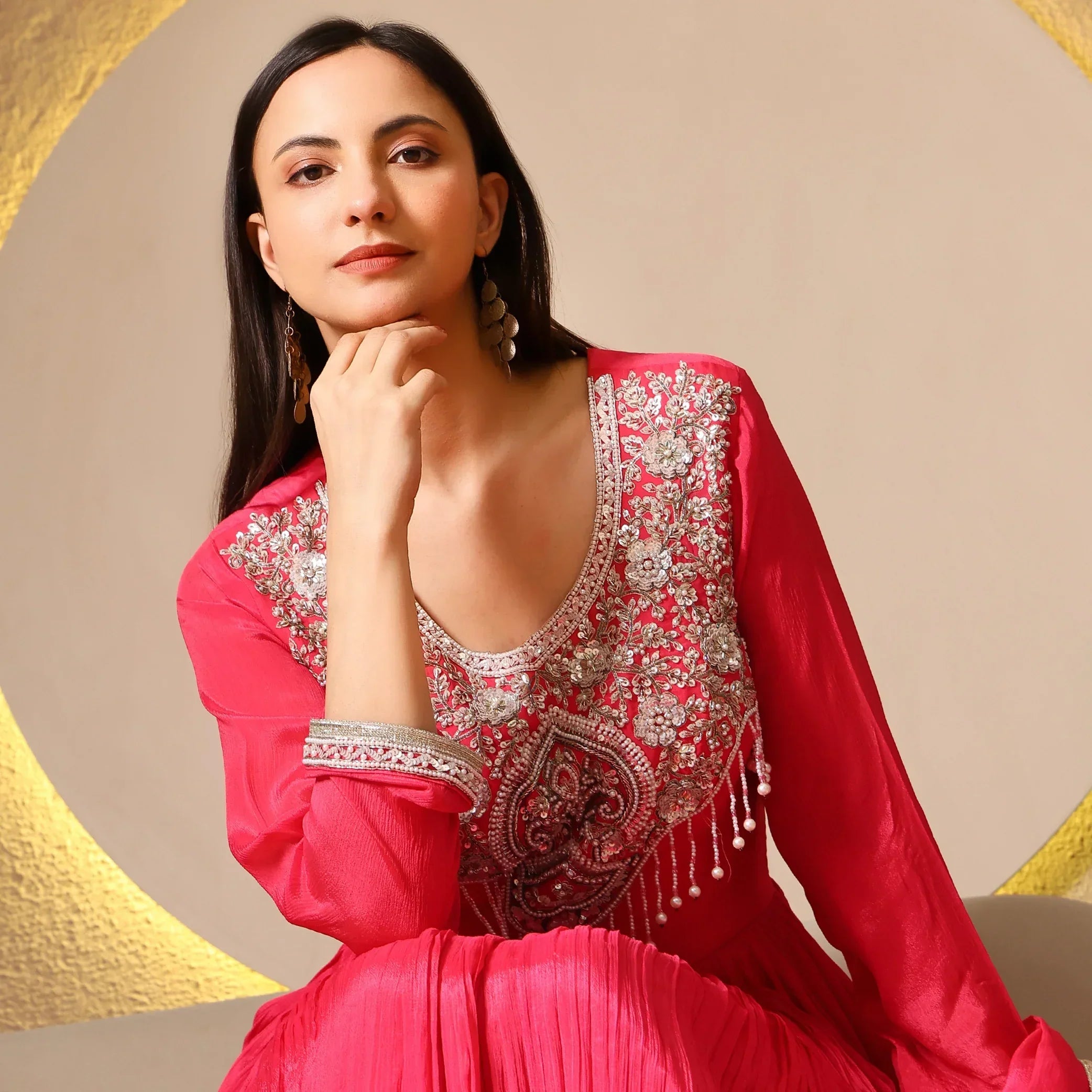 Woman in a pink Banarasi Anarkali suit with intricate silver embroidery, festive wear