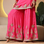 Pink ethnic palazzo suit with gold embroidery, ideal for festive or wedding wear