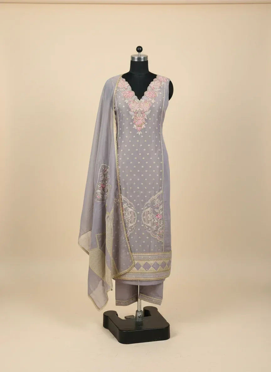 Lavender embroidered ethnic suit set with floral detailing, dupatta, and pants on mannequin