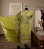 Olive green Banarasi Anarkali suit with floral embroidery on mannequin, elegant ethnic wear