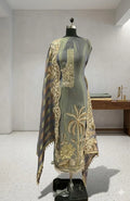 Elegant grey ethnic suit with golden floral embroidery and striped dupatta displayed on mannequin