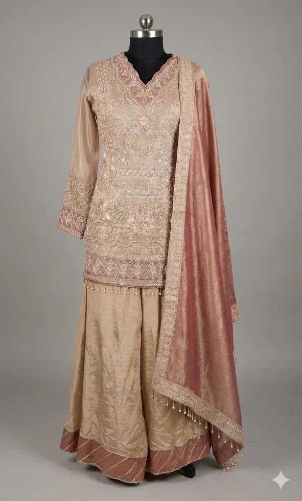 Embroidered beige ethnic suit with palazzo pants and dupatta, displayed on mannequin