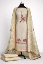 Beige Banarasi ethnic suit with pink palm embroidery and woven dupatta on mannequin