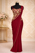 Maroon designer saree gown with gold embroidery on bodice, sleeveless, festive ethnic wear