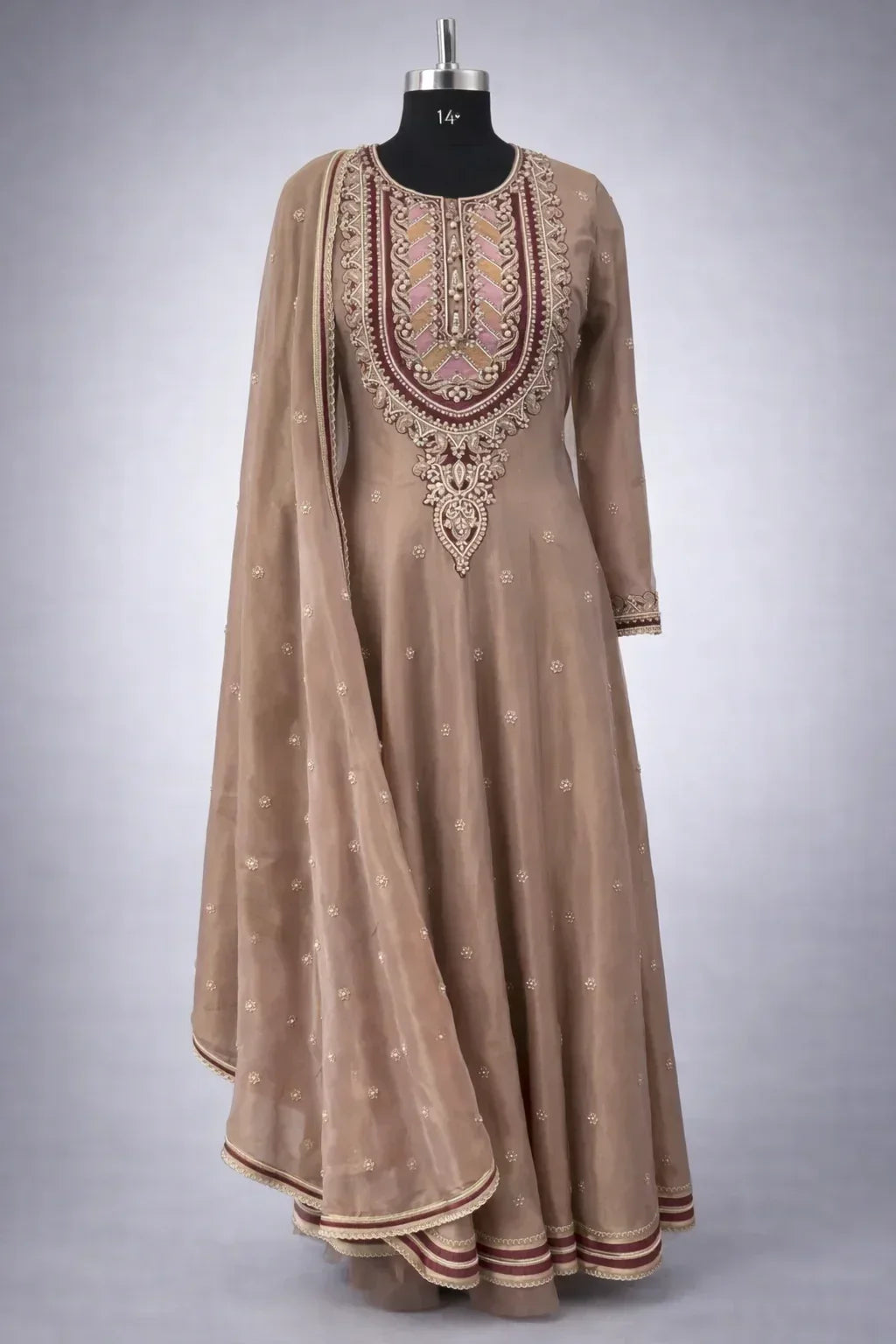 Embroidered beige Anarkali suit with dupatta, intricate neckline and traditional Indian design