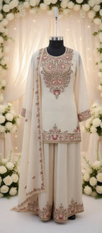 Ivory ethnic suit with pink floral embroidery and matching dupatta, ideal for weddings