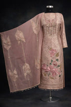 Blush pink embroidered ethnic suit with floral detailing and matching dupatta on mannequin
