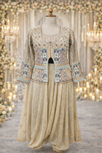 Embroidered Banarasi jacket with gold dhoti pants, displayed on mannequin in festive setting
