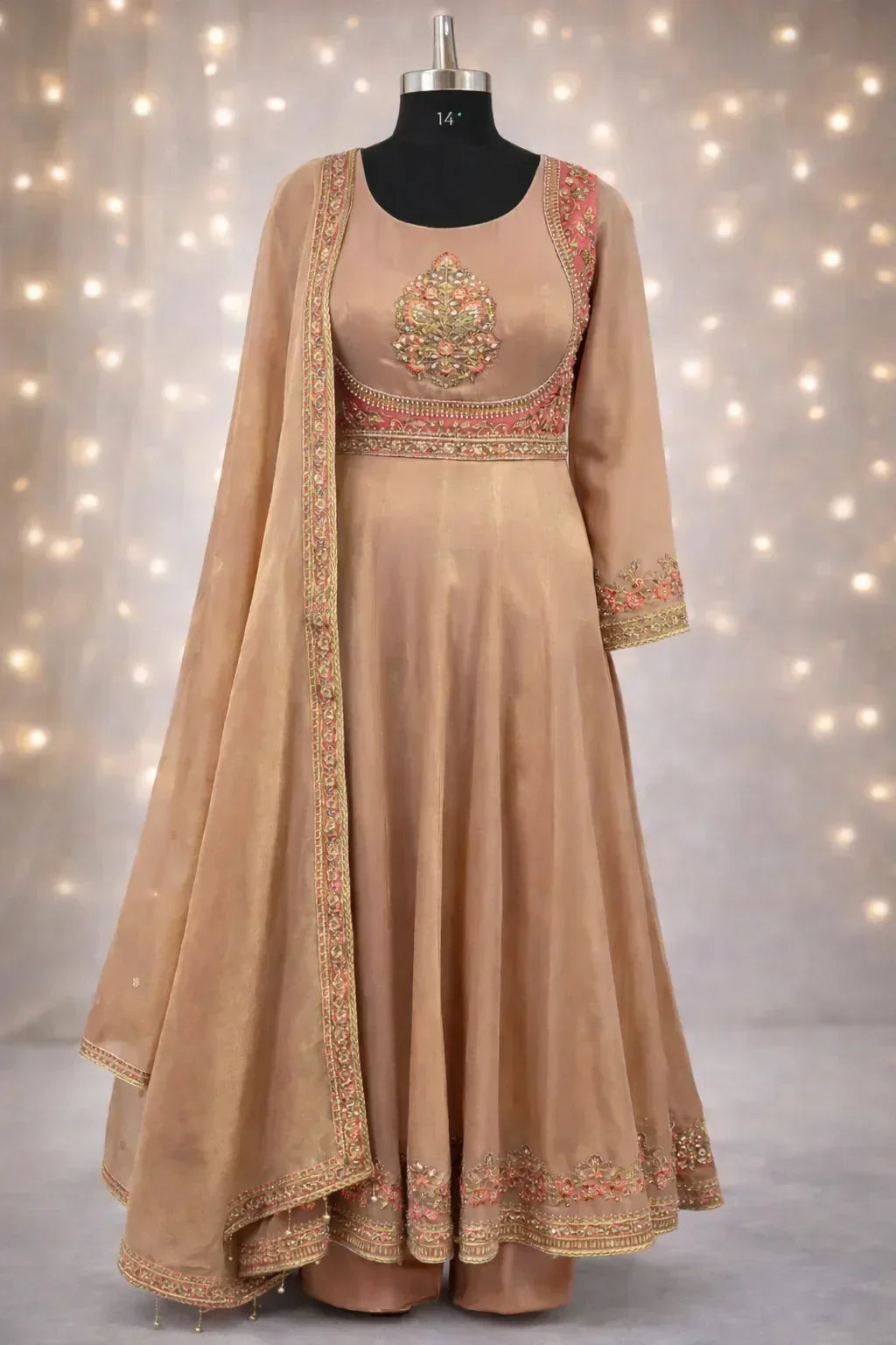 Beige Banarasi Anarkali suit with floral embroidery and matching dupatta on mannequin