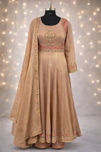 Beige Banarasi Anarkali suit with floral embroidery and matching dupatta on mannequin