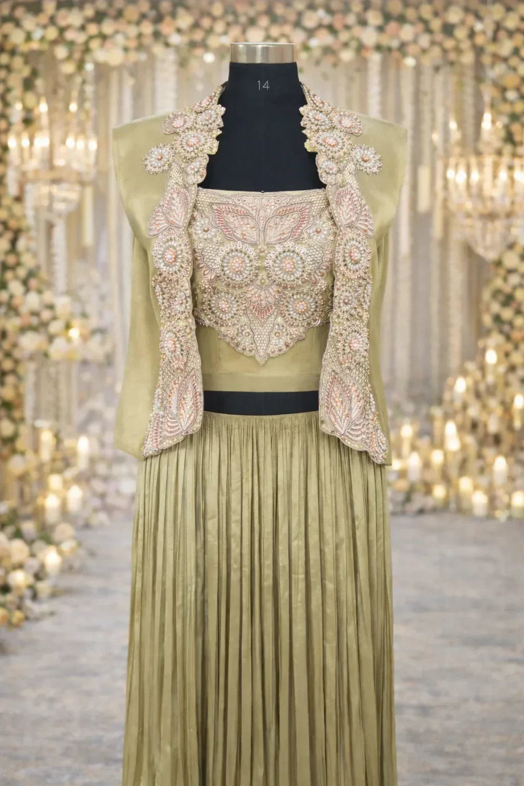 Olive green Anarkali suit with heavy embroidered bodice and pleated skirt for weddings