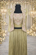 Olive green Anarkali suit with heavy embroidered bodice and pleated skirt for weddings