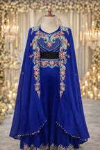 Royal blue Anarkali suit with floral embroidery and cape, ideal for weddings or festive occasions