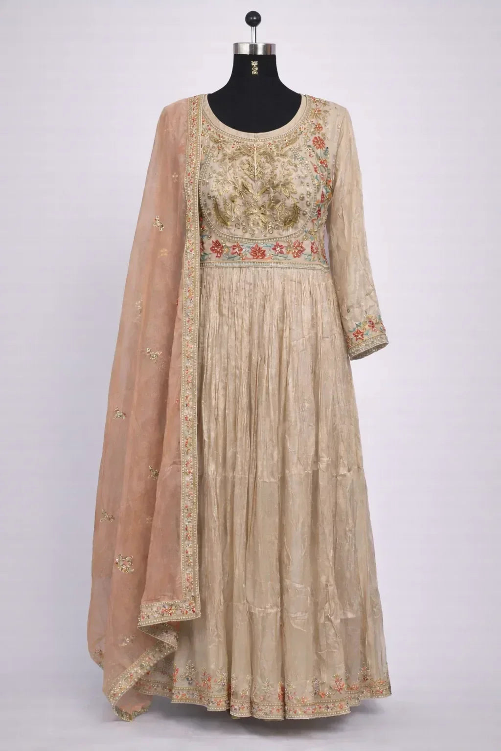 Beige Banarasi Anarkali suit with floral embroidery and matching dupatta, ideal for weddings