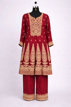 Red Banarasi Anarkali suit with gold embroidery, three-quarter sleeves, and matching pants