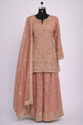 Dusty pink embroidered Anarkali suit with dupatta and intricate floral patterns, ideal for weddings and festive wear
