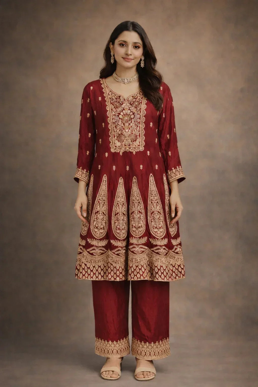 Woman wearing maroon Banarasi Anarkali suit with gold embroidery for festive occasions