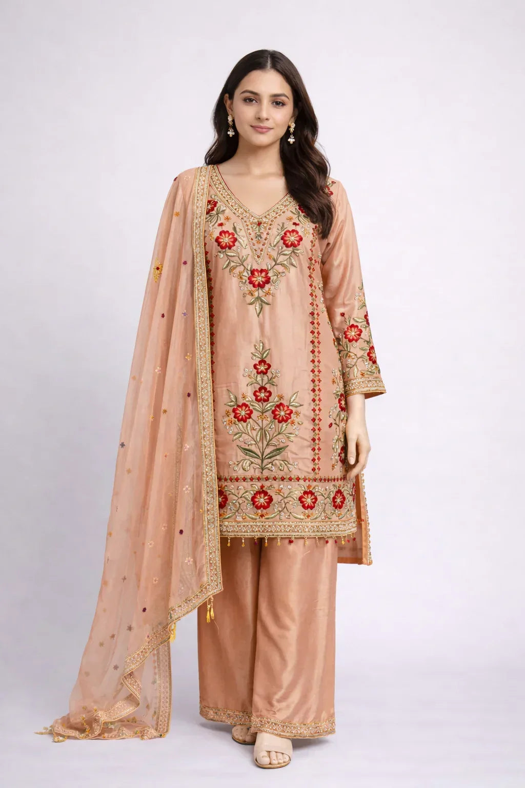 Woman wearing peach embroidered ethnic kurta set with floral motifs and dupatta