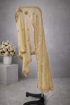Sheer golden embroidered dupatta with floral motifs and ornate border on display stand