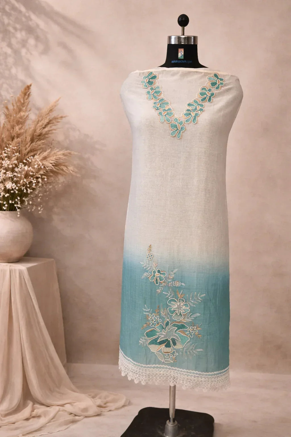 Ombre blue and white kurta with floral embroidery and lace trim, displayed on mannequin