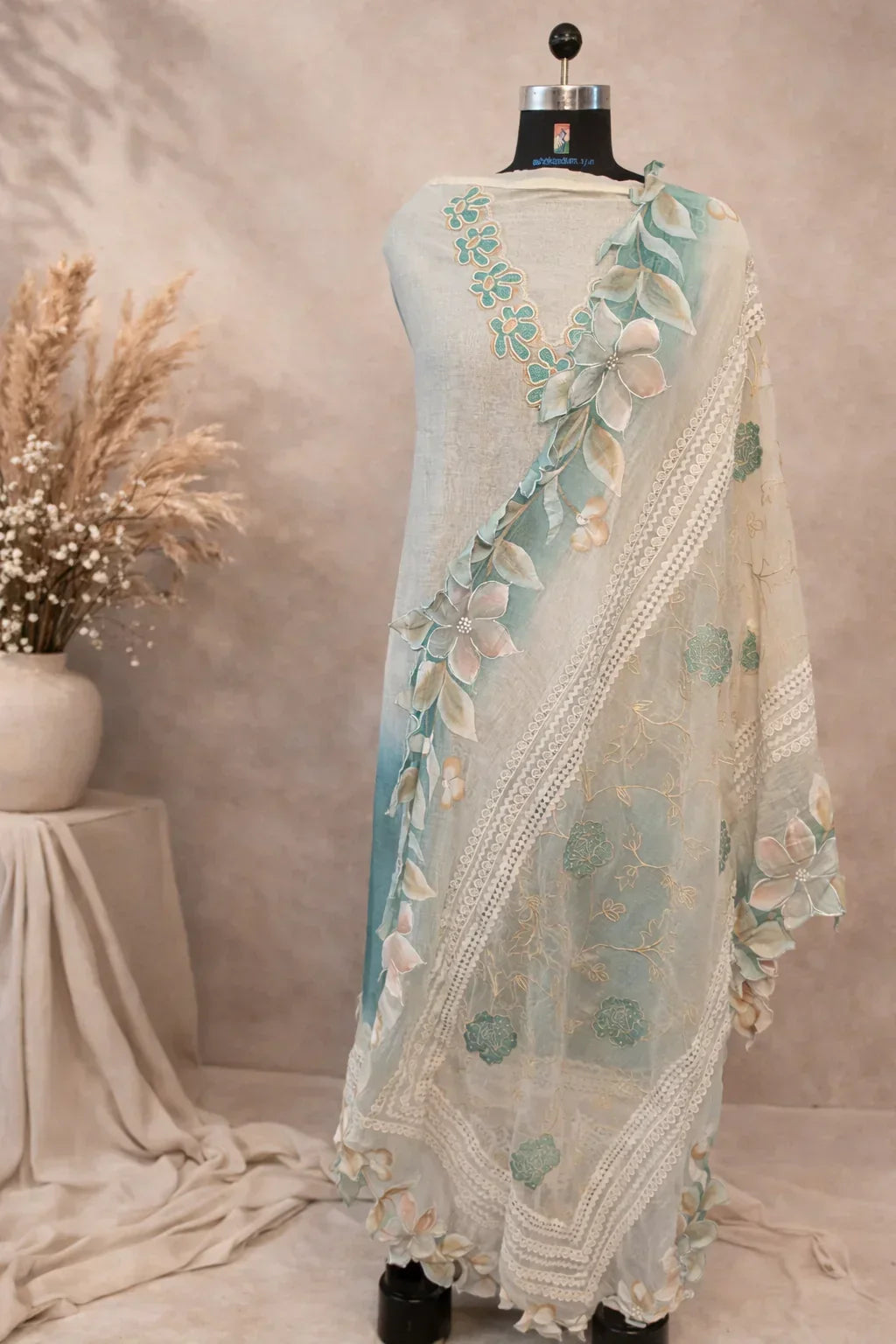 Pastel green floral embroidered ethnic dupatta displayed on a mannequin